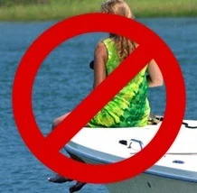 Child on bow of boat
